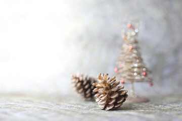 pine cone and mini golden Christmas tree