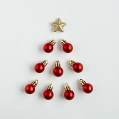 Christmas tree made of balls and golden star on a white background. Alternative Christmas tree.