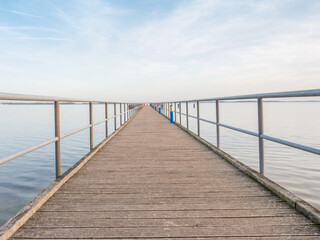 Fototapeta na wymiar Wooden terrace mole or pier in Dranske. Wooden dock pier. Baltic Sea
