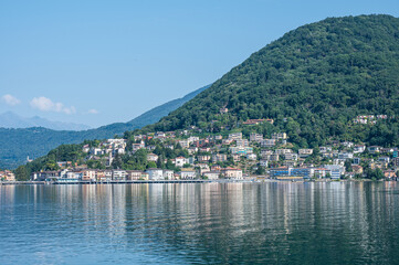 Fototapeta premium Landscape of the Lake Lugano with Ponte Tresa reflecting on the water