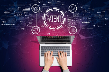 Patent concept with person using a laptop computer