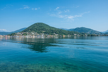 Landscape of the Lake Lugano with Ponte Tresa reflecting on the water