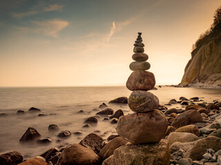 Stack of stones on Ruegen island beach. Rounded pebbles stacked