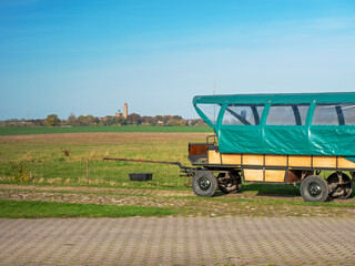 Car for tourists and lighthouse tour. Landscape with Cape Arkona lighthouse at Baltic