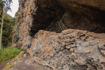 A group of hikers exploring Mau Mau caves at Mount Kenya National Park, Kenya