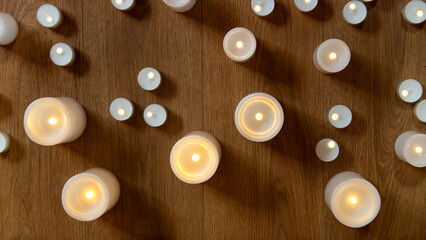 burning candles on wooden table. selective focus.	