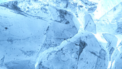 Abstract ice texture. A network of cracks on a piece of blue ice