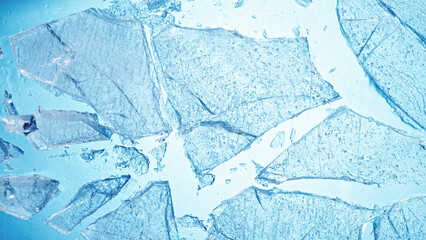 Abstract ice texture. A network of cracks on a piece of blue ice