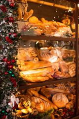Fototapeta na wymiar Christmas bakery showcase and Christmas garland