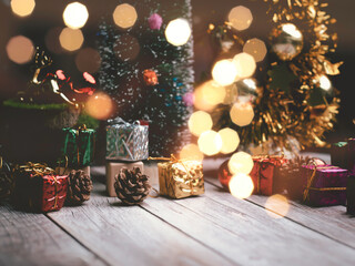 Christmas tree and gift box balls. Bokeh garlands in the blur background . cube block to contain...