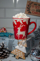 coffee with marshmallows in a red mug, new year atmosphere