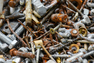 Lots of rusty bolts, self-tapping screws, nails close-up
