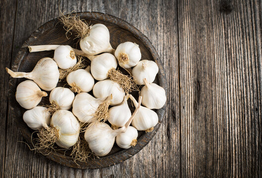 Fresh organic garlic on the wooden table