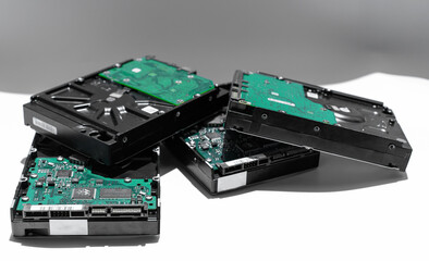 Several hard drives on a light background