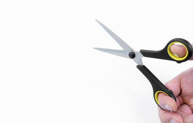 Hands and scissors on a white background