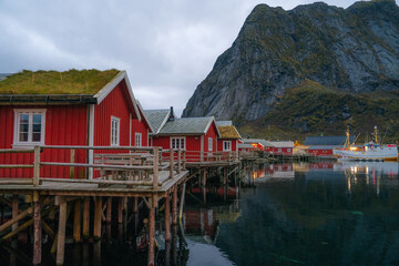 Reine at night, Lofoten, Norway. Traditional Norwegian fisherman with cabins. Photographed at dawn in autumn or winter.