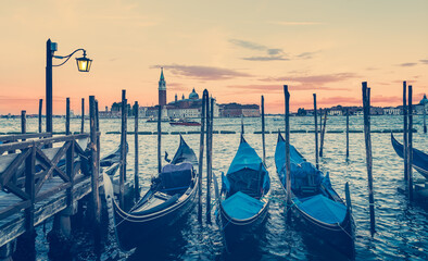 Gondolas in Venice Italy at dusk.