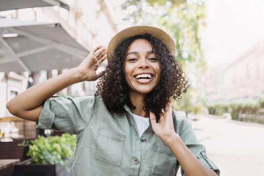 Young beautiful woman portrait, Happy african american student girl smiling in a city, People enjoy life, student lifestyle, city life, travel concept.