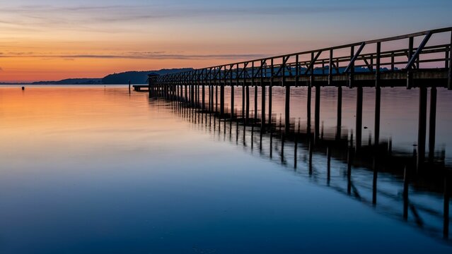 Pier in Harrislee on the Baltic Sea at sunrise