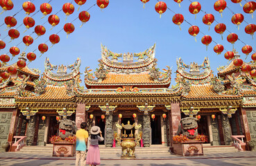 Couple Being Impressed by a Gorgeous Sian Lo Tai Tian Kong Chinese Buddhist Temple with Lunar New Year Decoration