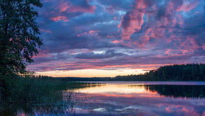 Purplish blue clouds over the lake