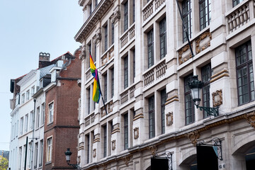 Fototapeta premium LGBT rainbow flag hanging outside a building near the Grand Place in Brussels