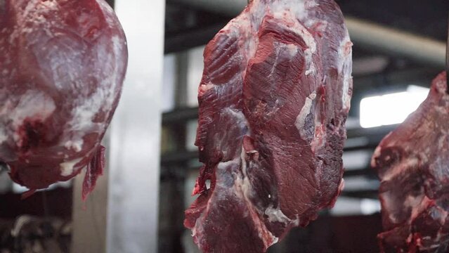 Close-up view of hanging beef in a market