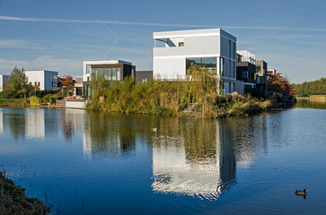 Utrecht, The Netherlands, November 13, 2022: neighbourhood with modern villas with brick, plaster...