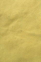 Fototapeta na wymiar Texture of dirty soft artificial yellow fabric, detailed fabric surface without folds and seams