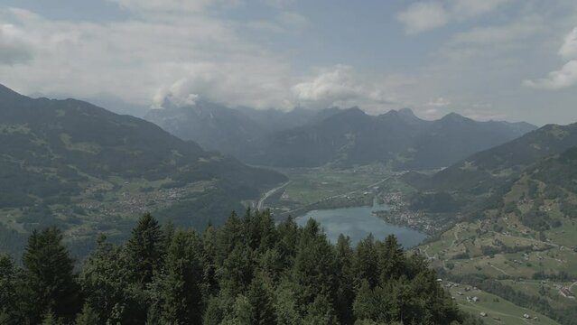 Aerial view of scenic mountainous landscape in Amden and a river in Switzerland
