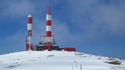 Antennas and transmission towers on the snowy hillside