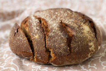 Round rye bread on a napkin