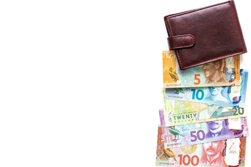 New Zealand dollars and wallet on a white background, all denominations of banknotes, copy space, business and financial concept