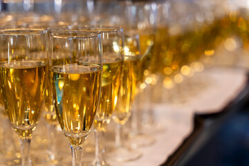 many beautiful glasses of champagne during a party on the table - Powered by Adobe