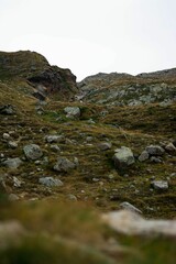 Vertical shot of the rocky hills against the background of the sky.