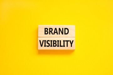 Brand visibility symbol. Concept words Brand visibility on wooden blocks. Beautiful yellow table yellow background. Business branding and brand visibility concept. Copy space. - obrazy, fototapety, plakaty