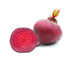 Whole fresh purple beet with sprouted leaves and half with cross section isolated on white...