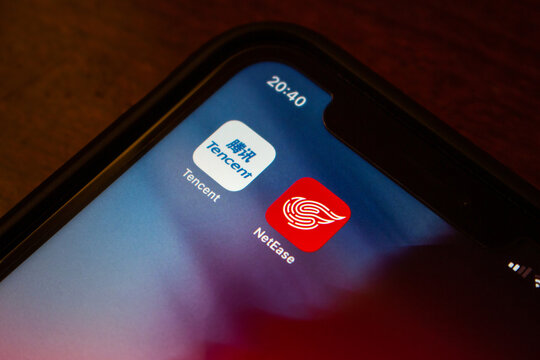 Vancouver, CANADA - Oct 17 2022 : China&rsquo;s big 2 game developer Tencent (Tencent Holdings) and NetEase icons on an iPhone screen.