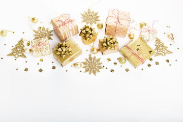 Christmas golden gift box design, golden balls, glitter stars snowflakes confetti isolated on white background.