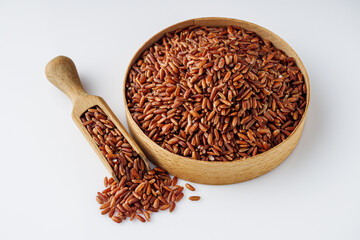 raw fresh red rice on a white background