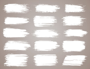 Paint brush. White ink grunge brush strokes. Vector paintbrush set. Grunge design elements. Painted ink stripes. Creative isolated spots. Ink smudge abstract shape stains and smear set