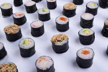  sushi maki rolls on white background
