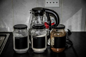 coffee and sugar holders next to the kettle.