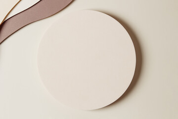 Blank round beige geometric shape podium platform on paper cut abstract minimal geometric shape...