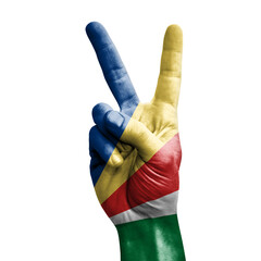 Hand making the V victory sign with flag of seychelles