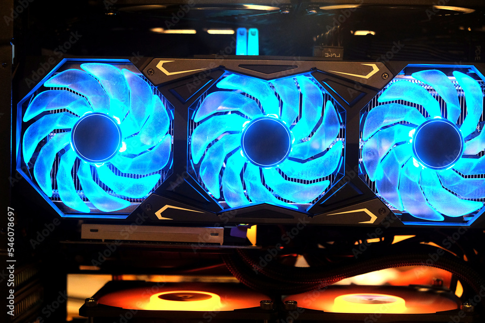 Poster close-up triple cooling fans on industrial high performance computer graphic card on standby mode fo