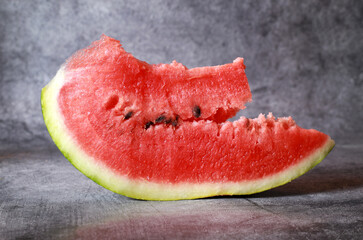 Slice of watermelon isolated on dark background