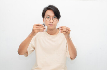 stop smoking start vaping concept. Cigarette vs e-cigarette concept. asian man holding cigarette and vape. quitting smoke concept. smoking versus vaping concept.