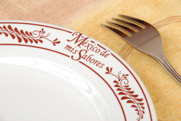 decorated traditional Mexican ceramic plate and fork, Mexico of my flavors