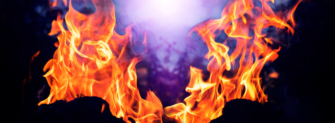 Abstract flame on a black and blue background. Fire for design